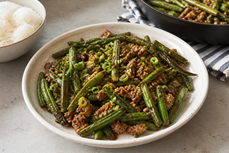 Chinese green beans with ground pork, green onion, and rice
